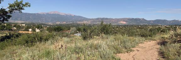 prairie with pikes peak in the background