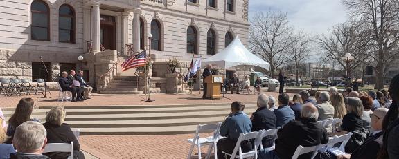 crowd and city council members waiting to be sworn in outside of the Pioneers Museum