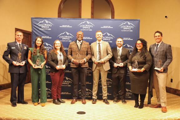 Mayor Yemi and the recipients of the 2025 Mayor's Young Leader Awards (from left to right): MSgt Connor Olney, Christina Lorete, Rachael Maxwell, Mayor Yemi, Preston Goff, Keith Bisaillon, Kimberly Gold and Samuel Clark.