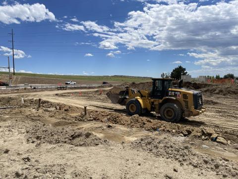 A bulldozer faces east on Barnes Rd. in August 2024.