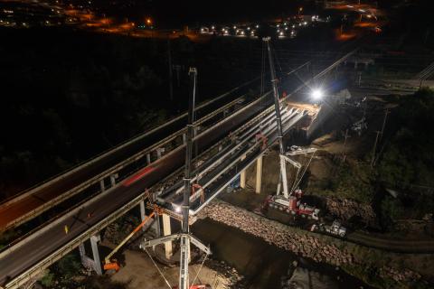 An image of the Circle Dr. Bridge construction taken at night.