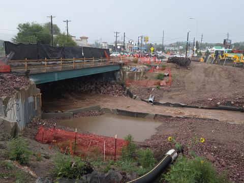 Rain pools below the bridge. The heavy rains of late August made it nearly impossible for crews to work safely in and around Fountain Creek.