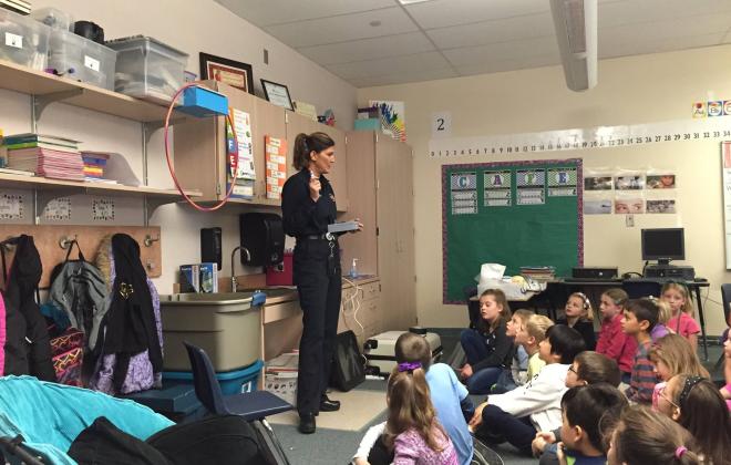 fire safety instructor teaching a classroom full of children