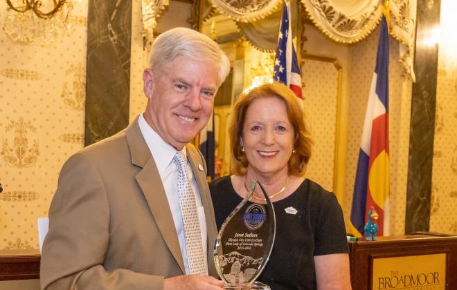 Janet Suthers and Doug Price holding the inaugural Janet Suthers Community Service Award