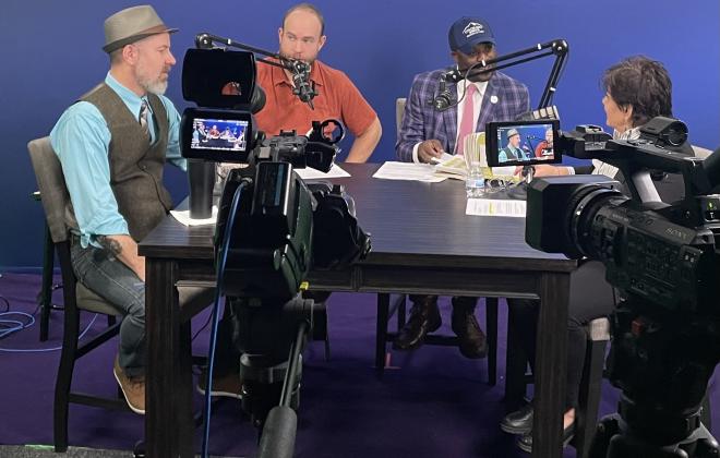 Mayor Yemi  and councilmember Michelle Talarico with members of the community on the set of behind the springs