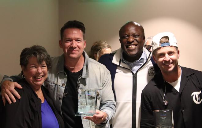 Mayor Yemi poses for a photo with Zach Filkins (left) and Ryan Tedder (right) of One Republic after presenting them with their Spirit of the Springs awards.