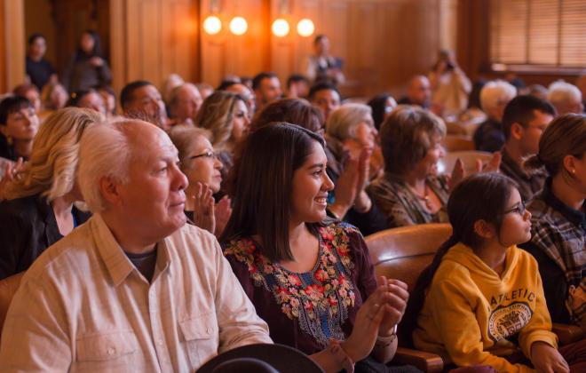 Attendees listening to a lecture in the pioneers museum