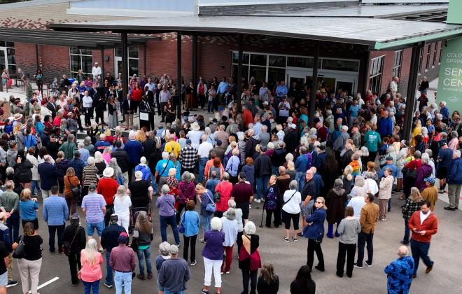 A crowd of residents and supporters gather for the Colorado Springs Senior Center ribboncutting.
