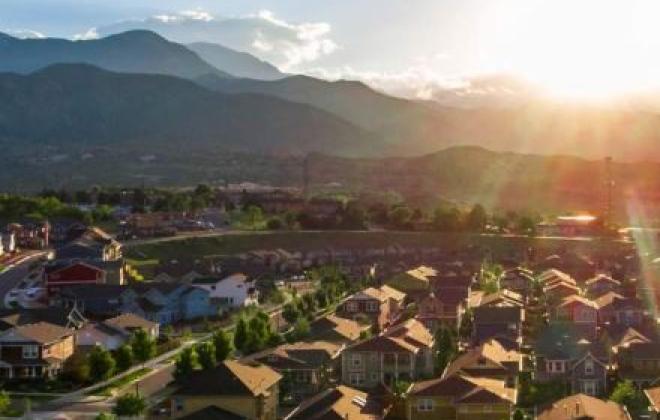 neighborhood with Pikes Peak in the background