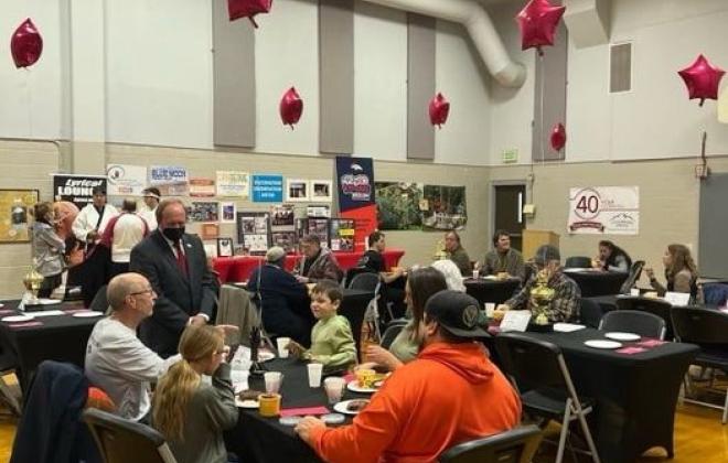 people attend a celebration dinner at Meadows Park Community Center