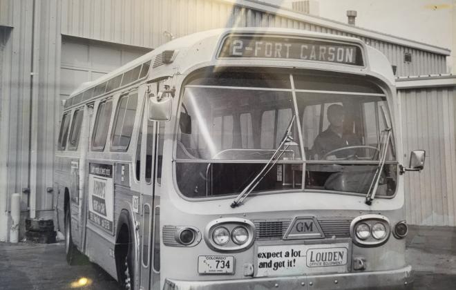 old black and white photo of a bus on route to Fort Carson