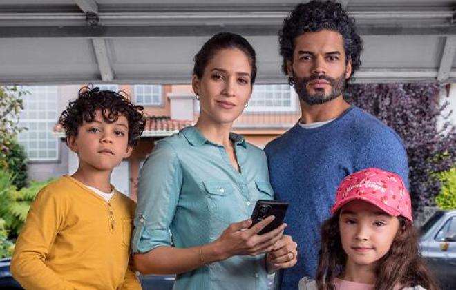 a mother, father, and two children stand confidently in front of an open garage door. The neighborhood and street is visible behind them. "Resolve to be ready"