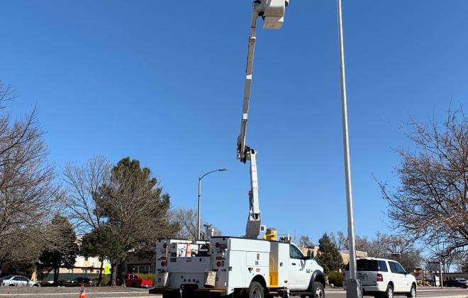 bucket truck installing a streetlight