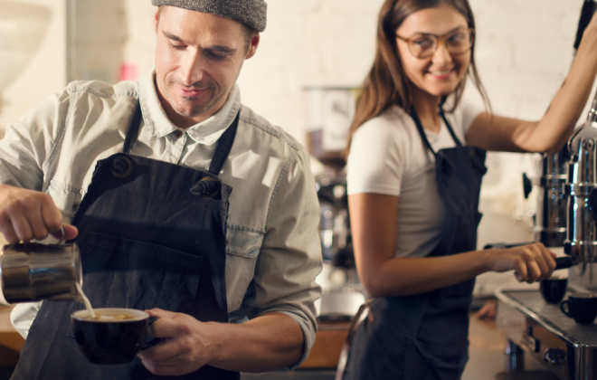 barista pouring coffee and woman working expression machine