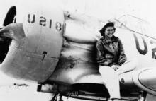 Millicent Peterson Young in front of a plane.