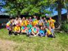 large group of people in brightly colored shirts