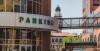 large parking sign on the garage downtown